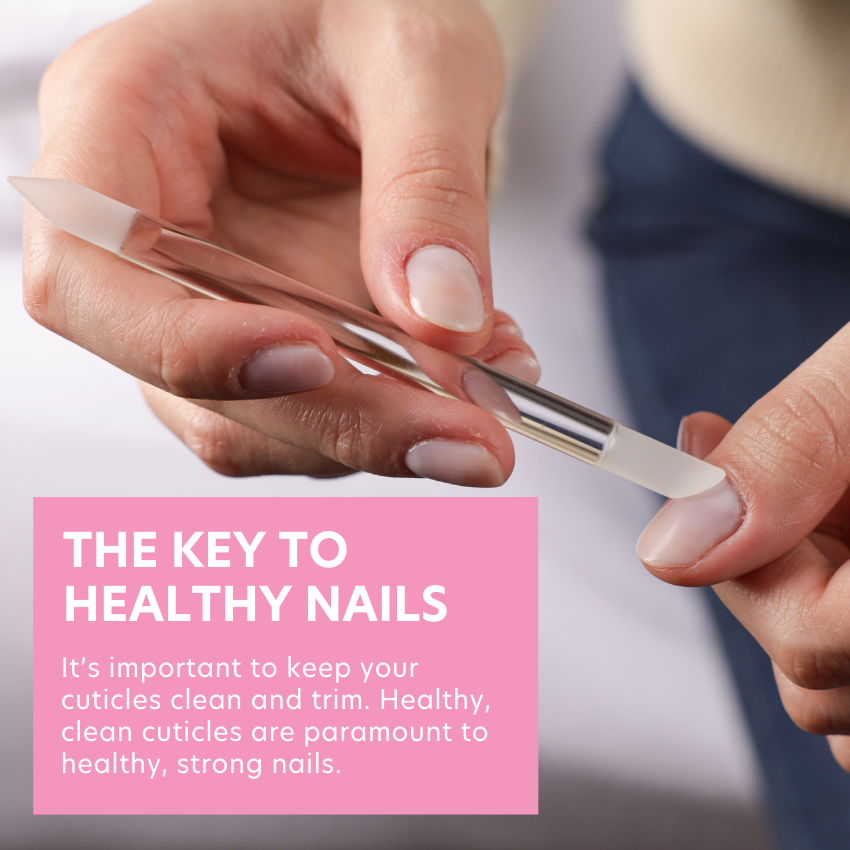 Model is using Czech glass cuticle pusher to push back cuticles