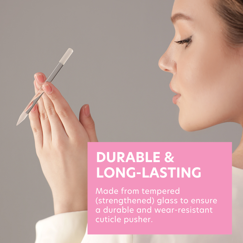 Model is posing with cuticle pusher with it intertwined in her fingers