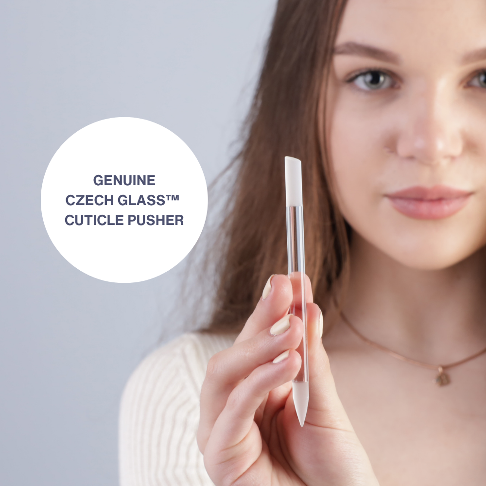 Model holding Czech glass cuticle pusher towards the camera
